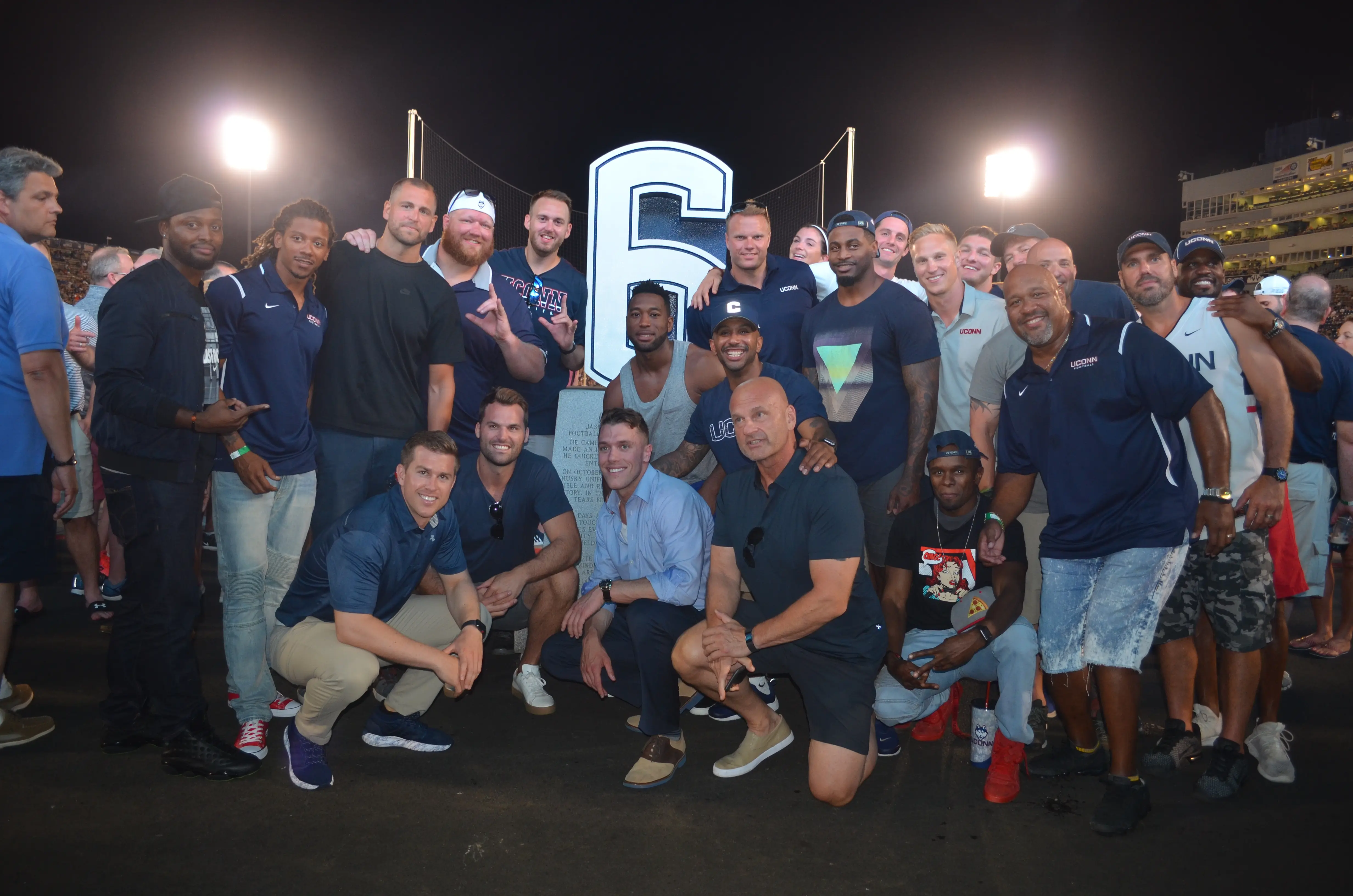 alumni at Jazz statue without coach 2018